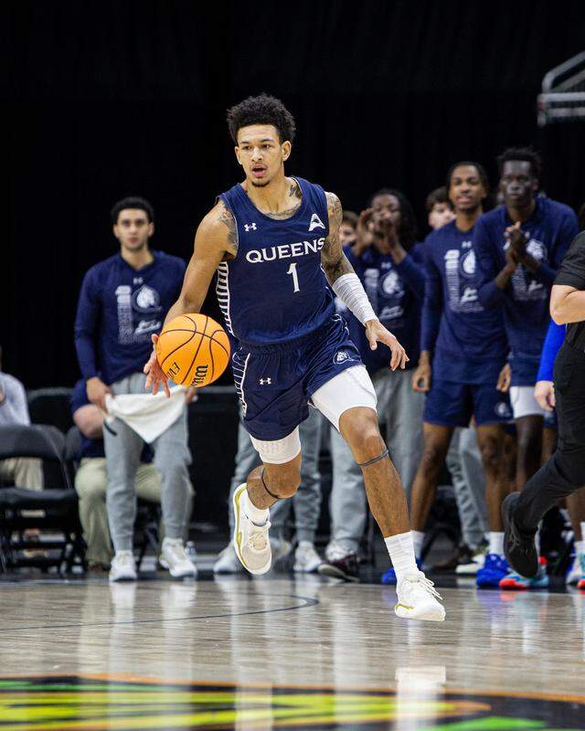 Queens senior guard Nasir Mann dribbles down the court in the ASUN championship game on March 8, 2026. Queens beat Central Arkansas in overtime, 98-93, and Mann was named the tournament’s most valuable player.